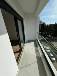 Modern balcony in Ulcinj with glass railings and tile floors, ideal investment. Exclusive at montenegro-listings.me by Ekosphere doo.