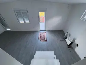 Spacious, bright Ulcinj property with gray floors, white walls & 3 windows. Exclusive listing by ekosphere doo on montenegro-listings.me.