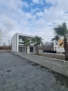 For sale: Modern two-story white house with balconies in Ulcinj, Montenegro. Exclusive on montenegro-listings.me by Ekosphere doo.