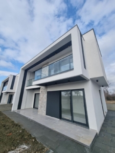 Stunning modern two-story home in Ulcinj with glass balcony, stone accents, and luxury finishes—exclusive by montenegro-listings.me.