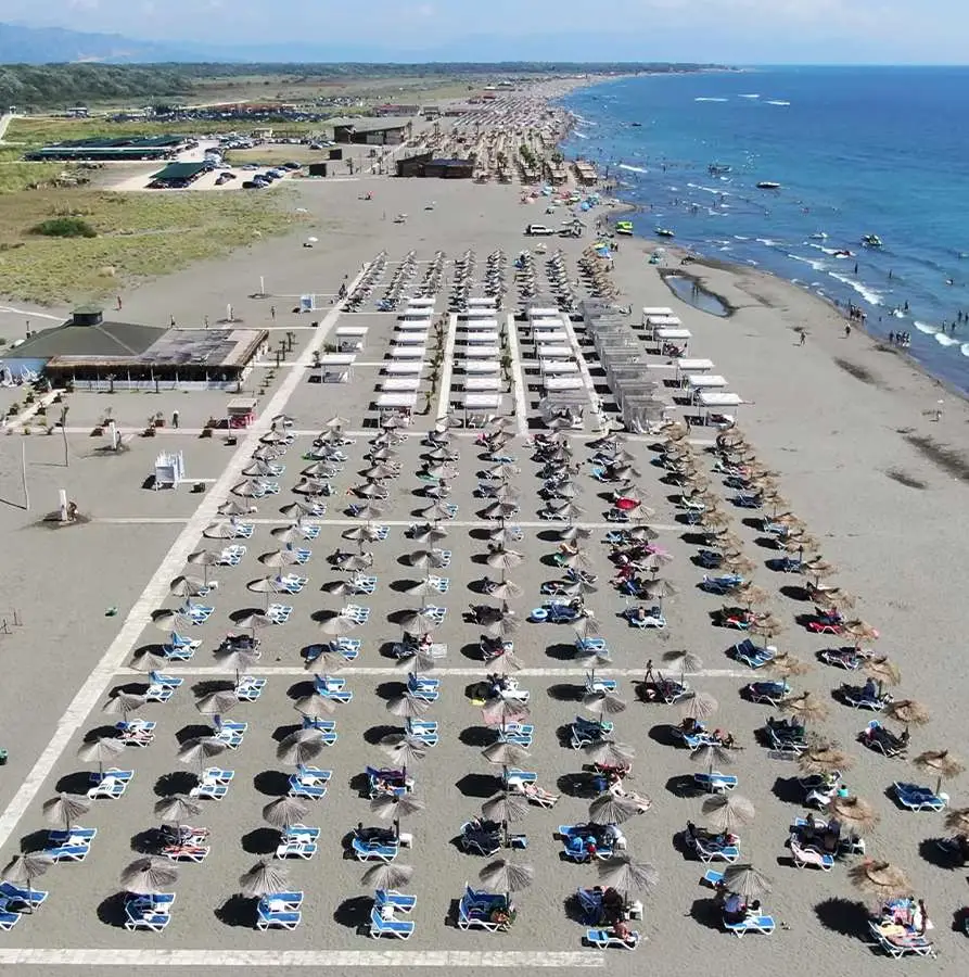 Premium Ulcinj beachfront real estate—vibrant sandy shores, sunlit relaxation, top investment by montenegro-listings.me (ekosphere doo).