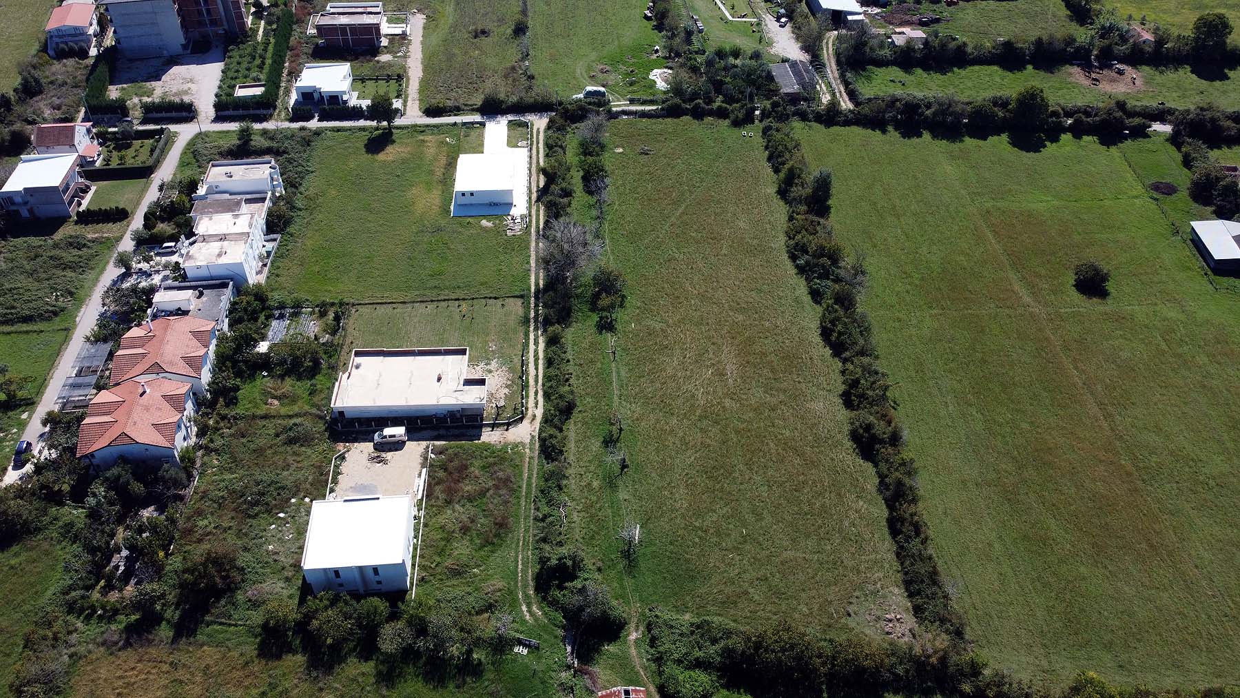 Premium Ulcinj properties: picturesque homes amid lush green fields, trees, and open land. Invest at montenegro-listings.me&mdash;by ekosphere doo.