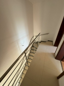 Modern staircase with metal railings, tiled steps, and light floors in Ulcinj—exclusive property by montenegro-listings.me, ekosphere doo.