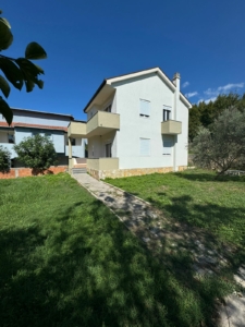 Elegant two-story white home with balconies in Ulcinj, Montenegro—ideal real estate investment. Listed by ekosphere doo on montenegro-listings.me.
