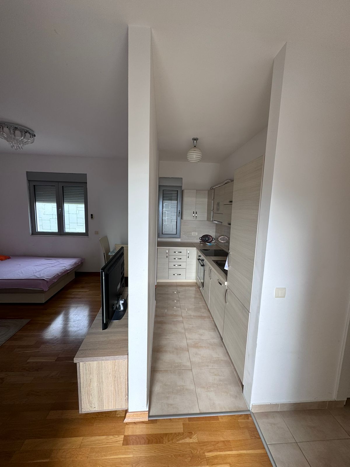 Modern Ulcinj apartment: cozy double bedroom, compact kitchen, smart layout ideal for investment. Listed on montenegro-listings.me by ekosphere doo.