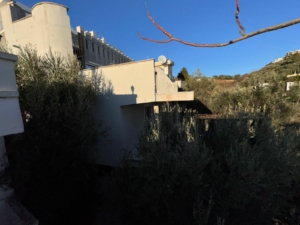 Modern white property for sale in Ulcinj, Montenegro, by Ekosphere DOO. Sunny roof with satellite dishes, clear sky—exclusive listing.