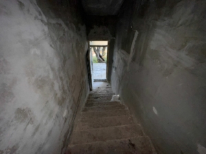 Discover investment potential in Ulcinj, Montenegro—unfinished concrete staircase, sunlit view, exclusive with montenegro-listings.me by ekosphere doo.