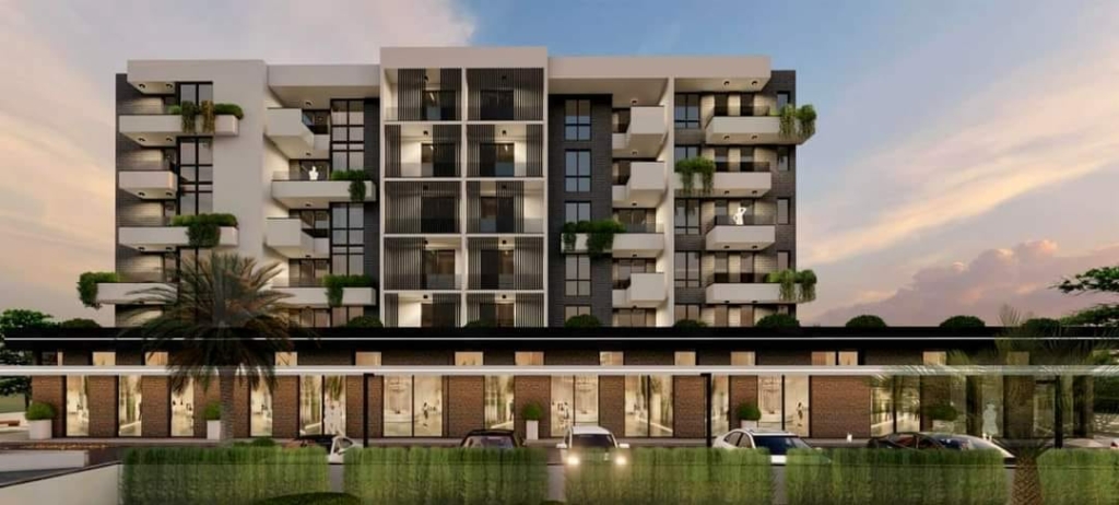Modern Ulcinj apartment building with balconies, lush terraces, glass-fronted ground units. Invest via montenegro-listings.me (ekosphere doo).