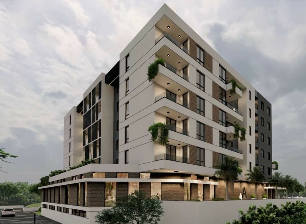Stylish multi-story apartments in Ulcinj, Montenegro—balconies, large windows, lush green views; exclusive on montenegro-listings.me by Ekosphere.