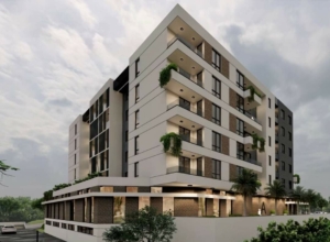 Stylish multi-story apartments in Ulcinj, Montenegro—balconies, large windows, lush green views; exclusive on montenegro-listings.me by Ekosphere.