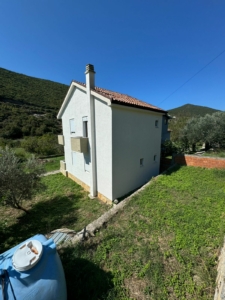 Modern white two-story house with red-tiled roof in Ulcinj, Montenegro—ideal investment listed on montenegro-listings.me by Ekosphere.