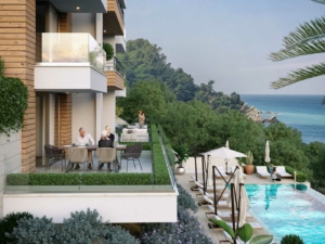 Luxury modern balcony in Ulcinj with sea views, pool, lush greenery—exclusive real estate by montenegro-listings.me, a project of Ekosphere.