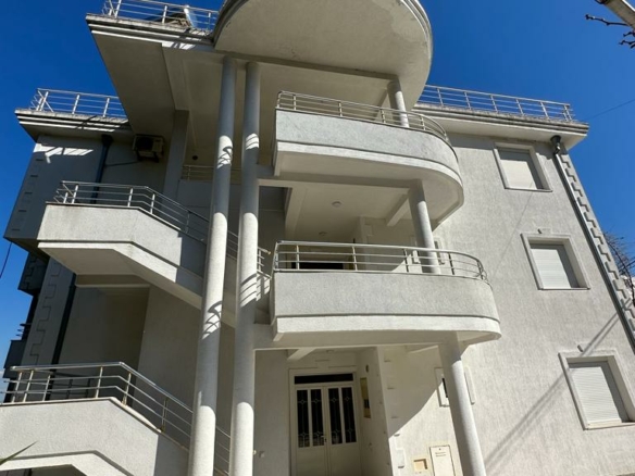 Stunning modern 3-story property in Ulcinj, Montenegro—rounded balconies, tiled walkway. Invest via montenegro-listings.me by ekosphere doo.