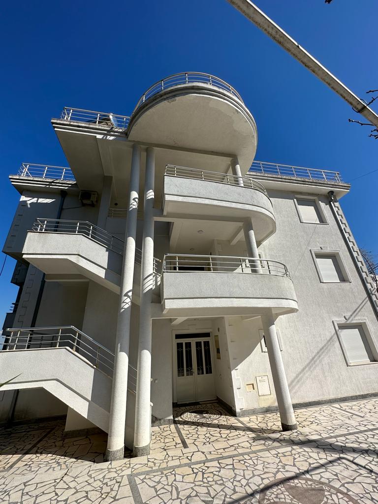 Stunning modern 3-story property in Ulcinj, Montenegro&mdash;rounded balconies, tiled walkway. Invest via montenegro-listings.me by ekosphere doo.