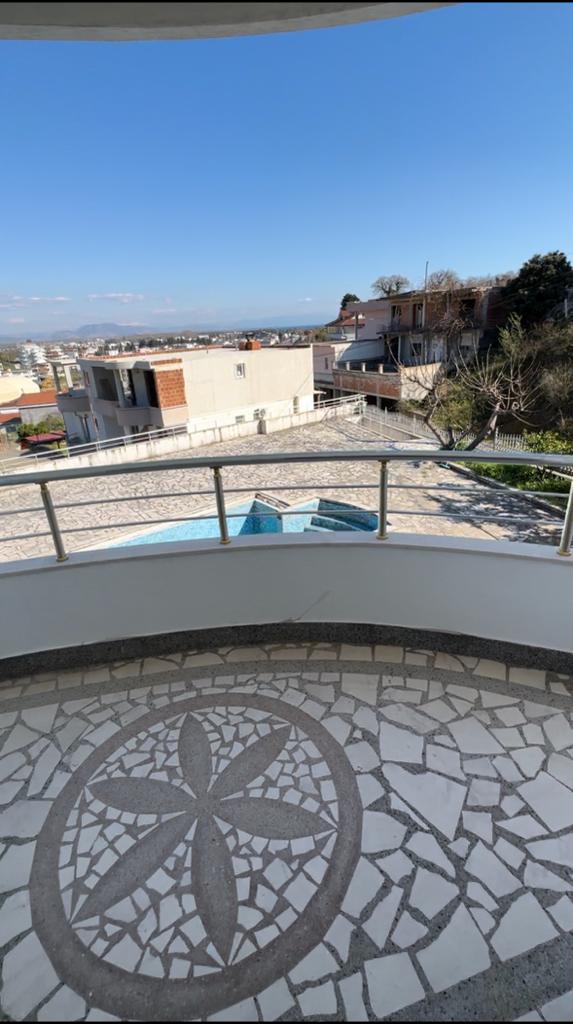 Modern balcony with flower mosaic tile flooring, street and building views in Ulcinj&mdash;prime real estate from ekosphere&rsquo;s montenegro-listings.me.