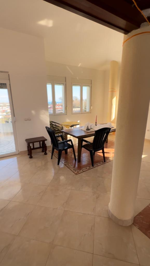 Bright dining area with tiled floors, modern furnishings, and sunlit windows&mdash;invest in Ulcinj Montenegro real estate at montenegro-listings.me by ekosphere doo.