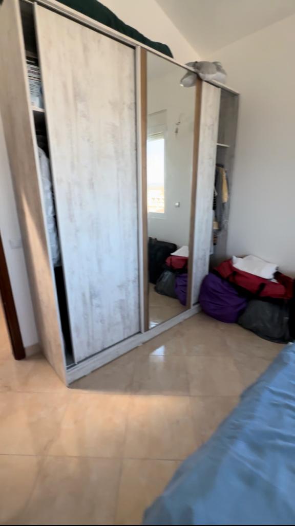 Modern bedroom in Ulcinj, Montenegro with mirrored wardrobe, spacious layout, and investment appeal. Listed on montenegro-listings.me by ekosphere doo.