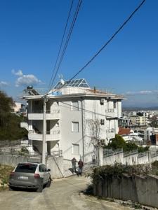 Modern three-story white property with balconies on a sloped street in Ulcinj, prime real estate by montenegro-listings.me/Ekosphere.