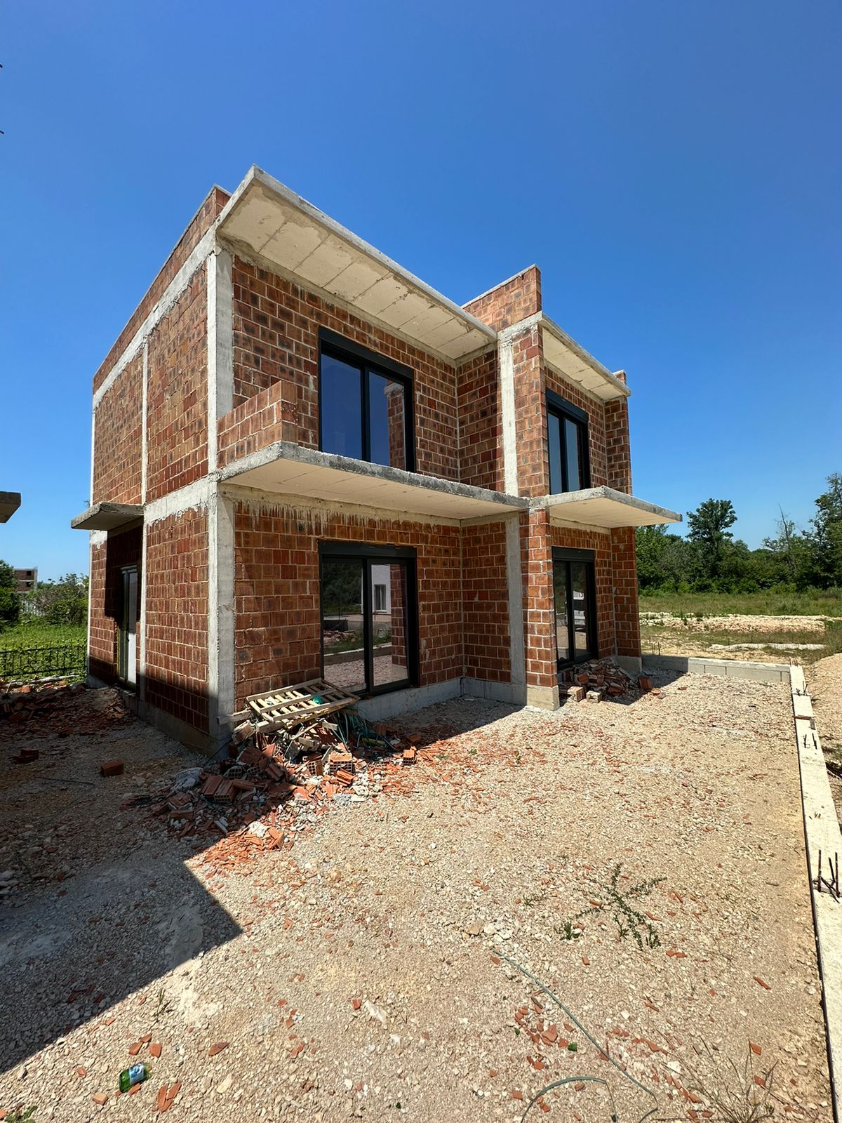 Modern two-story house under construction in Ulcinj, Montenegro&mdash;prime real estate investment from ekosphere doo via montenegro-listings.me.