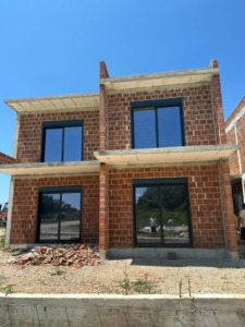Modern two-story house under construction in Ulcinj, Montenegro—prime investment. Seen on montenegro-listings.me by ekosphere doo.