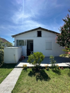Charming white house in Ulcinj, Montenegro with patio, garden, and lawn—ideal for investment. Listed by ekosphere doo on montenegro-listings.me.