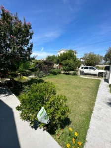 Discover this Ulcinj Montenegro property: lush lawn, mature trees, gated access, and prime curb appeal. Invest via montenegro-listings.me by ekosphere doo.