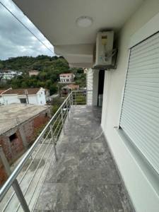 Stylish tiled balcony with metal railing, AC, and scenic Ulcinj views—ideal Montenegro investment via montenegro-listings.me by ekosphere doo.