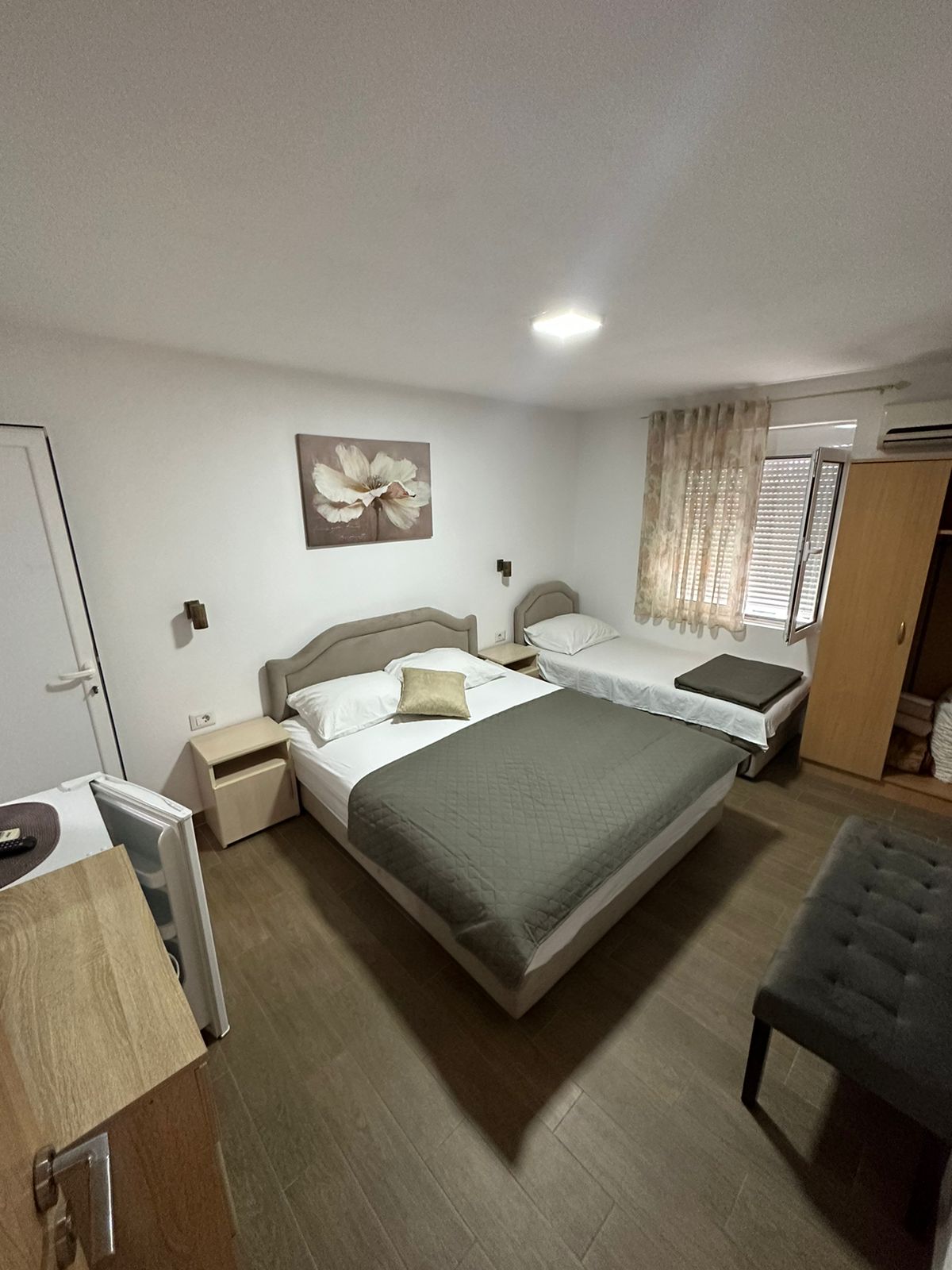 Modern hotel room in Ulcinj, Montenegro with double and single beds&mdash;ideal investment via montenegro-listings.me by Ekosphere doo.