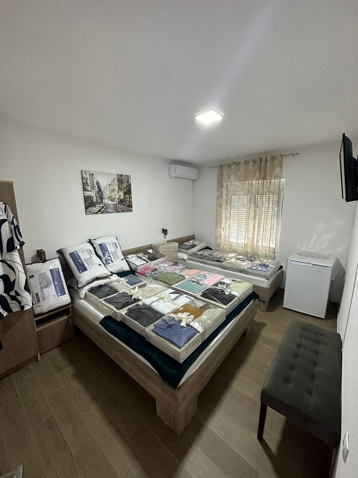 Modern Ulcinj property: 2-bed room, wood floors, wall TV, fridge, city view decor. Prime investment on montenegro-listings.me by ekosphere doo.