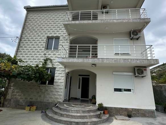 Modern three-story home in Ulcinj, Montenegro with balconies, AC units, and charming entry—ideal real estate by ekosphere doo.