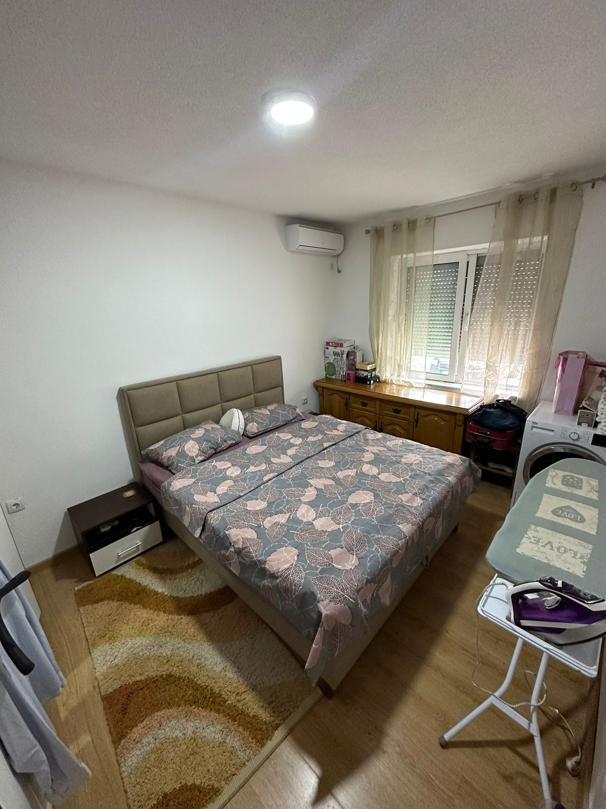 Elegant Ulcinj bedroom with double bed, stylish decor, and natural light&mdash;prime property from montenegro-listings.me by Ekosphere DOO.