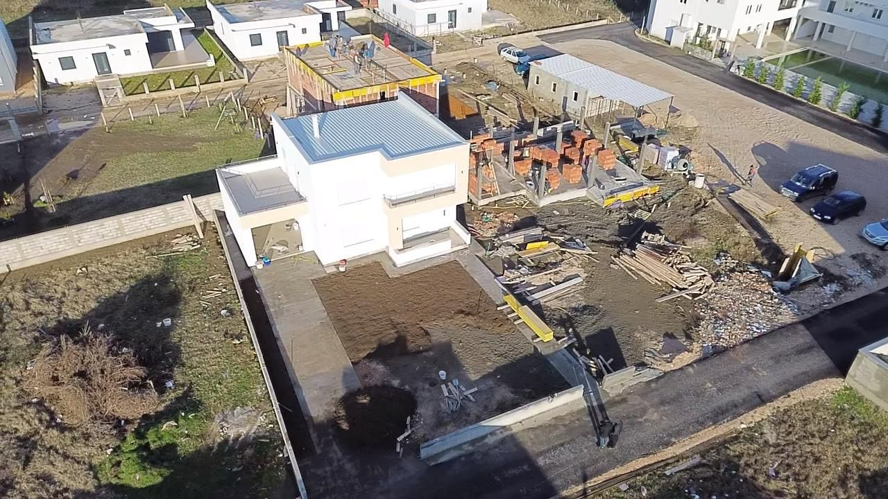 Exclusive aerial view of prime Ulcinj, Montenegro real estate—new homes rising near completed properties; invest with montenegro-listings.me by Ekosphere doo.