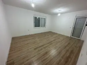 Spacious, sunlit Ulcinj property featuring modern wood floors, glass door, prime investment. Listed on montenegro-listings.me by ekosphere doo.
