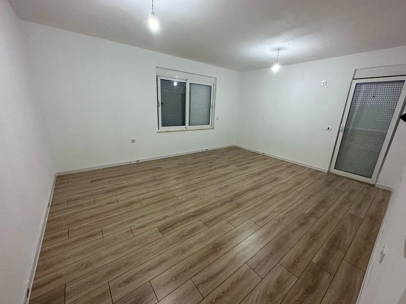 Spacious, sunlit Ulcinj property featuring modern wood floors, glass door, prime investment. Listed on montenegro-listings.me by ekosphere doo.