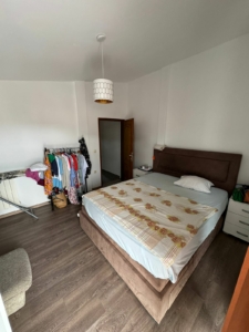 Charming Ulcinj bedroom with double bed, modern storage, and natural light—prime Montenegro investment. eksophere doo project.