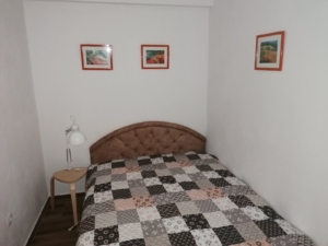 Cozy Ulcinj bedroom with double bed, stylish décor, and investment appeal—featured by montenegro-listings.me, a project of ekosphere doo.