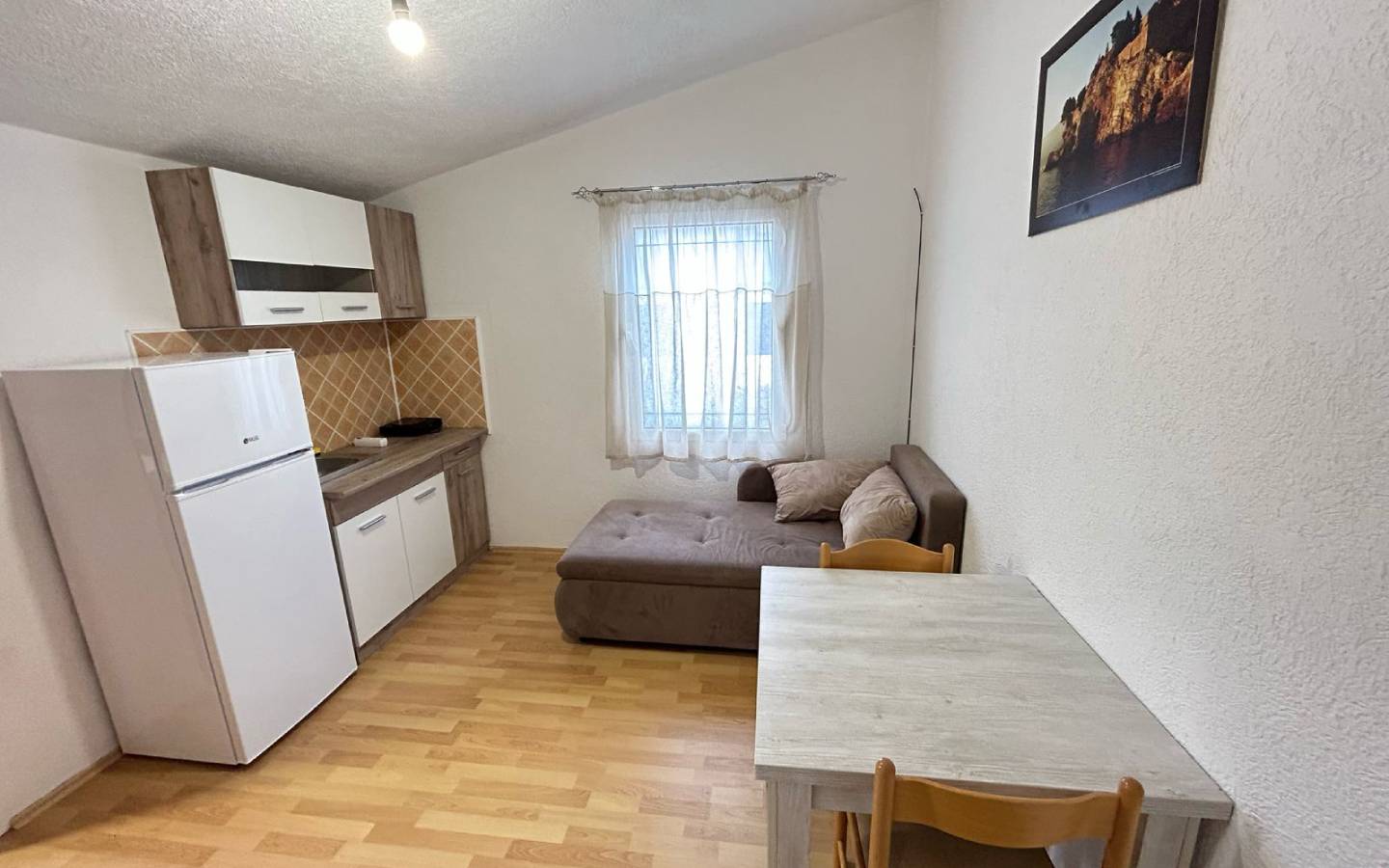 Bright kitchen-living space with wood floors, quality furnishings in Ulcinj&mdash;prime investment from montenegro-listings.me by Ekosphere.