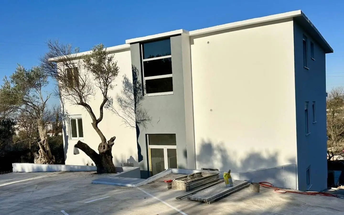 Modern two-story villa with large windows in Ulcinj, Montenegro—prime investment listing by montenegro-listings.me, ekosphere doo.