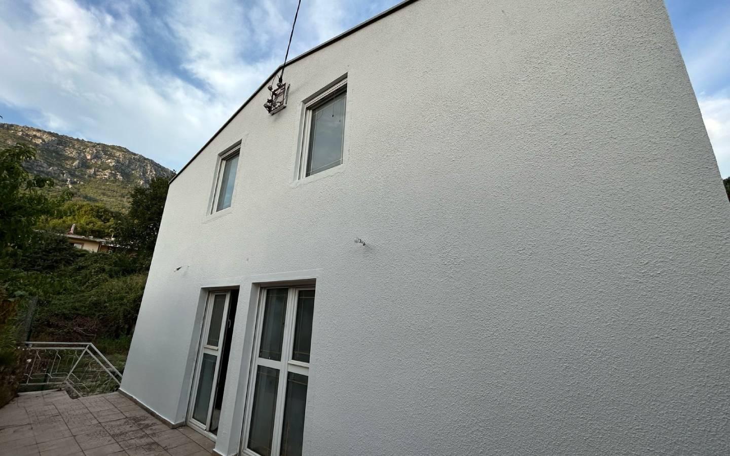 Modern two-story white residence in Ulcinj, Montenegro with mountain views&mdash;ideal investment on montenegro-listings.me by ekosphere doo.