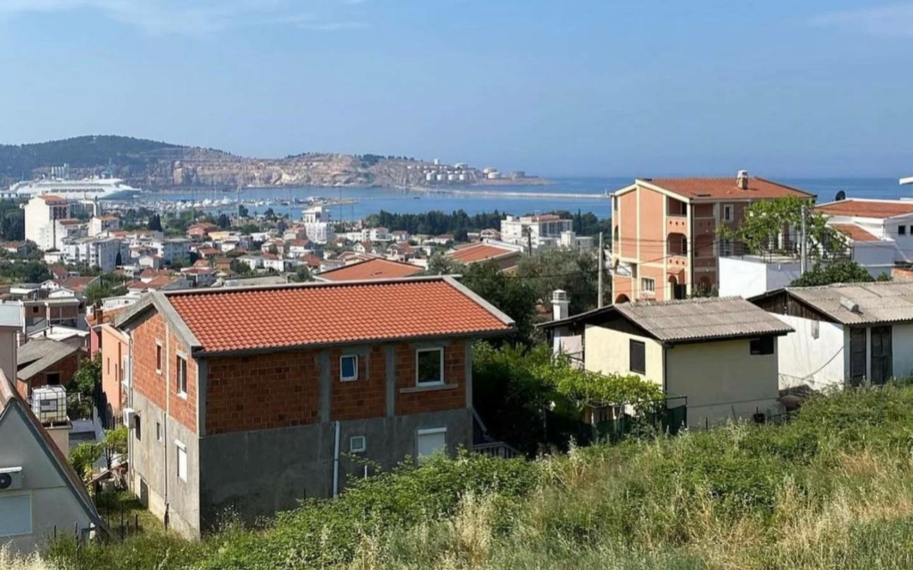 Panoramic Ulcinj, Montenegro: red-roof homes, lush greenery, harbor views&mdash;premium real estate by Ekosphere on montenegro-listings.me.