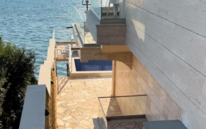 Waterfront modern home in Ulcinj with pool, stone patio, and glass railings—exclusive at montenegro-listings.me by Ekosphere d.o.o.