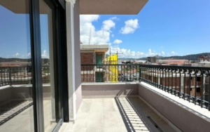 Modern tiled balcony with sleek railing, city views, and investment potential in Ulcinj, Montenegro. By Ekosphere DOO on montenegro-listings.me.