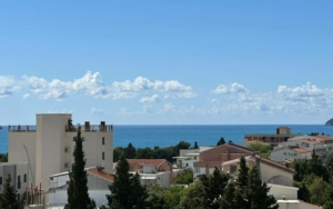 Premium Ulcinj real estate with red-tiled roofs, sea views, lush trees—exclusive on montenegro-listings.me by Ekosphere doo.