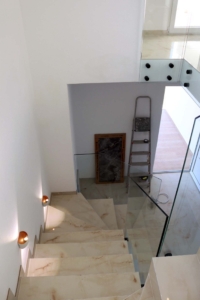 Stunning modern staircase with marble steps, glass railings in Adana Villa—exclusive Ulcinj real estate by montenegro-listings.me.