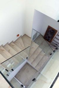 Elegant marble staircase with glass railings in Adana Villa, Ulcinj—exclusive listing on montenegro-listings.me by ekosphere doo.