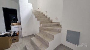 Elegant marble staircase with sleek, modern design—prime Ulcinj Montenegro property on montenegro-listings.me by ekosphere doo.
