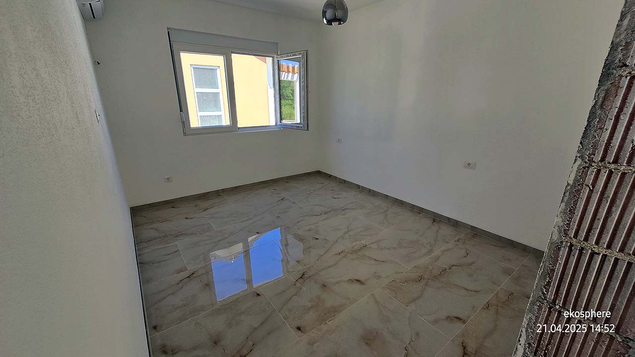 Bright, modern Ulcinj apartment with glossy marble tiles, white walls, city views&mdash;exclusive on montenegro-listings.me by Ekosphere Doo.