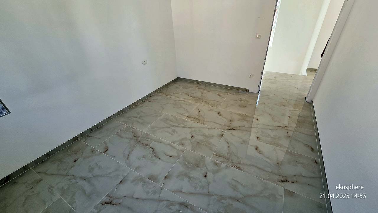 Bright, spacious room with marble floors and white walls in Ulcinj&mdash;prime Montenegro real estate by ekosphere doo on montenegro-listings.me.
