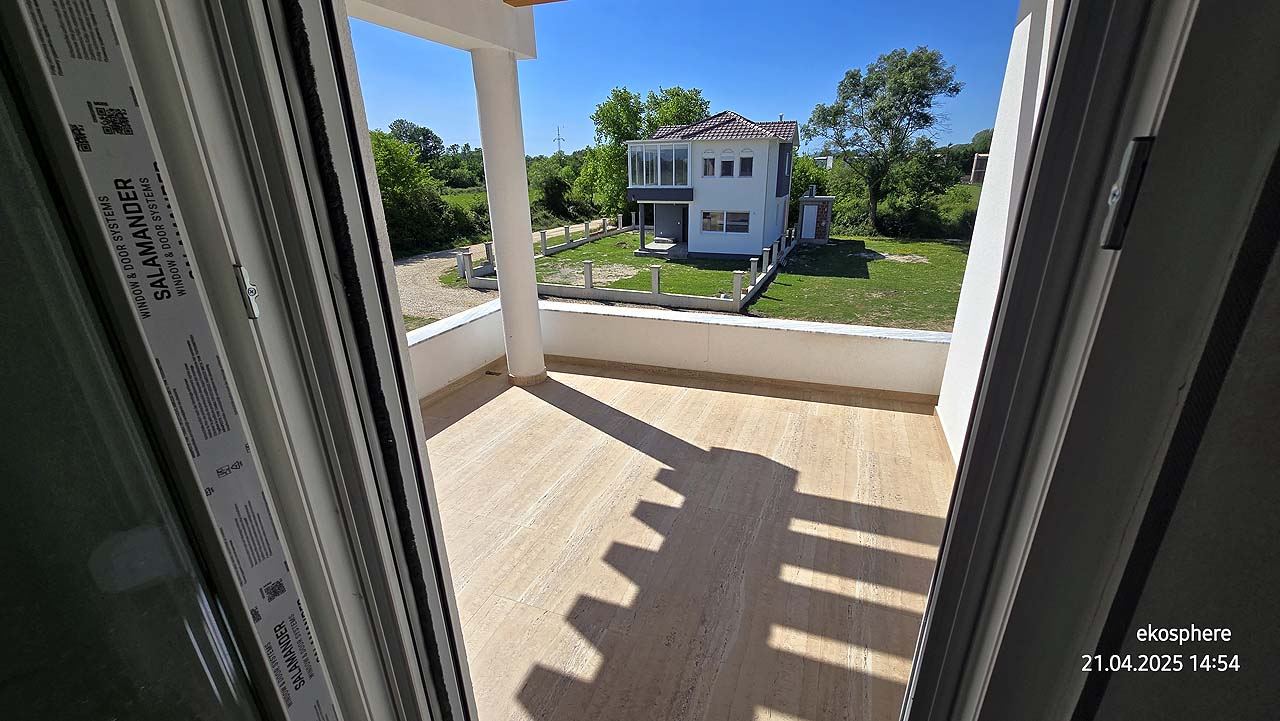 Spacious balcony with light flooring, green yard, and 2-story house in Ulcinj. Prime investment via montenegro-listings.me/Ekosphere doo.