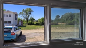Spacious Ulcinj property: bright windows, white house, green trees, and SUV—prime Montenegro investment by EkoSphere Doo.
